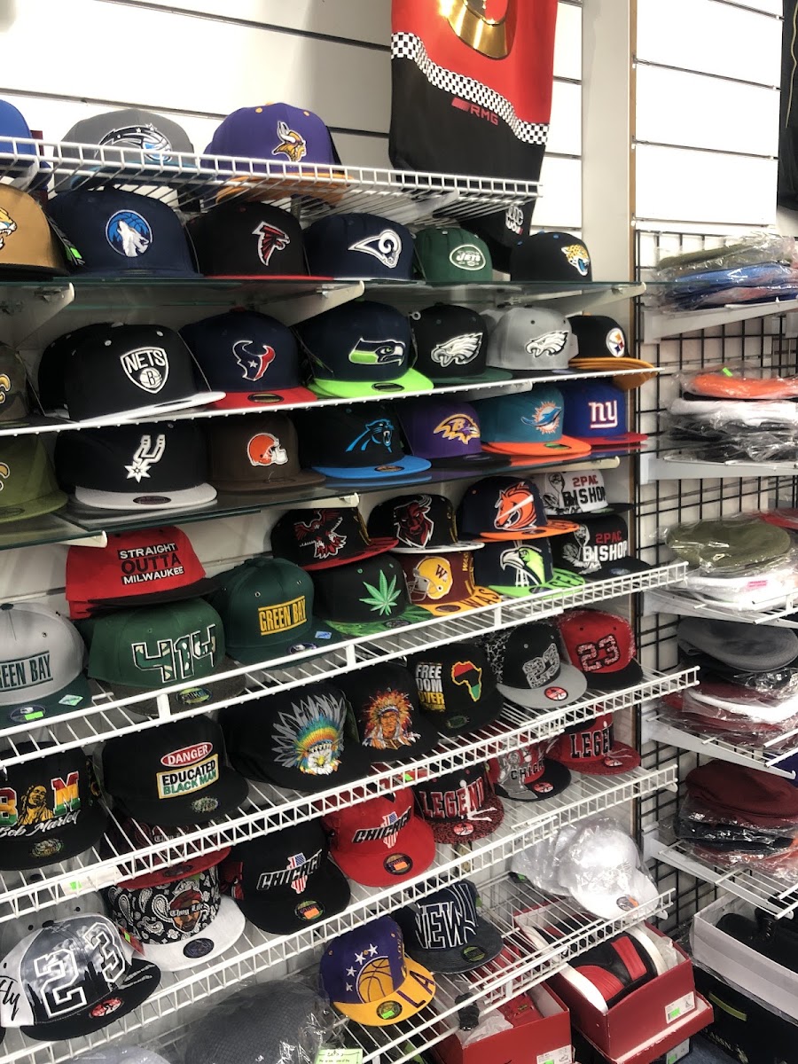 J J Sports storefront and hat wall