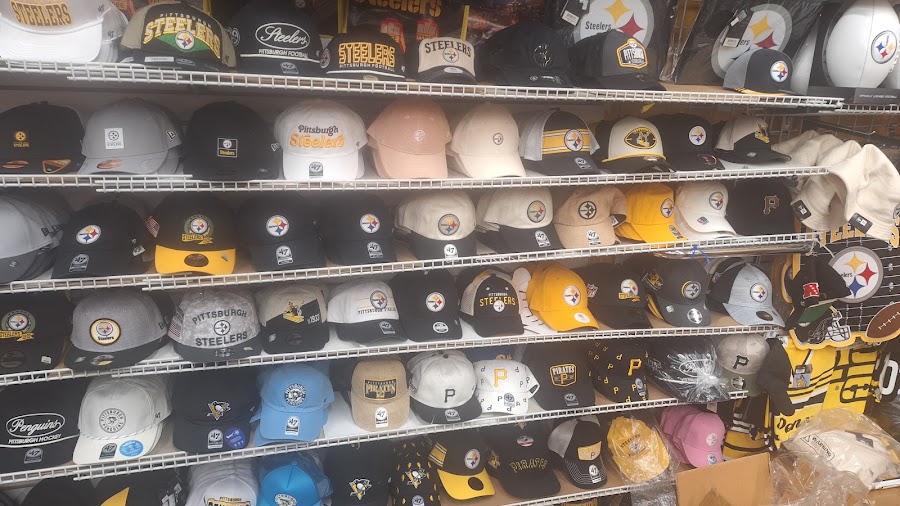PGH Sports storefront and hat wall