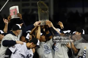 2009 World Series celebration with Yankees players holding championship trophy