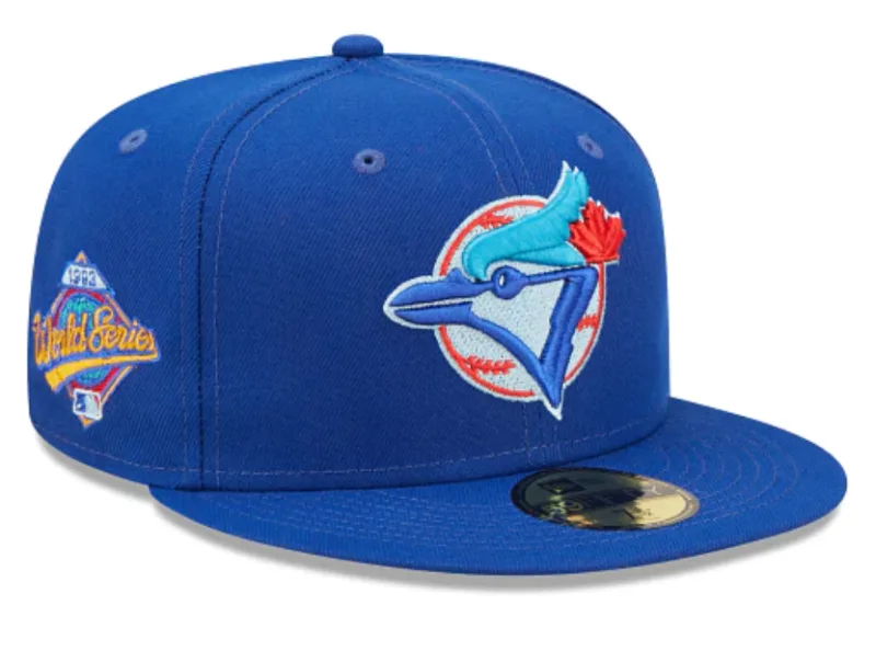 New Era Toronto Blue Jays fitted hat blue, royal colorway - 1993 World Series Fitted: New Era’s Royal Blue Blue Jays Championship Tribute with Clouds Bottom