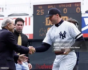 1999 World Series celebration with New York Yankees players holding championship trophy