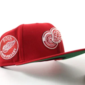 New Era Detroit Red Wings fitted hat Scarlet Red Green Under brim colorway - Century of Hockeytown Fitted: New Era Drops Red Wings 100th Anniversary Tribute