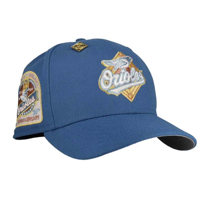 New Era Baltimore Orioles fitted hat grey, blue colorway - Baltimore Orioles 30th Anniversary Fitted: New Era Honors Camden Yards Legacy in Metallic Indigo